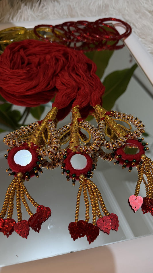 Handcrafted crimson red and gold Lachha Dori with mirror centres, zari wrapping, gold bead tassels and red sequin leaf drops — view 2