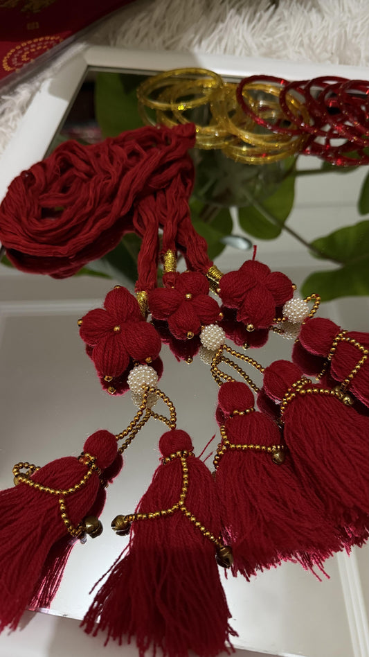 Crimson red handcrafted Lachha Dori with floral yarn motifs, faux pearl clusters, gold seed beads and tassel detail — Behuli — view 2