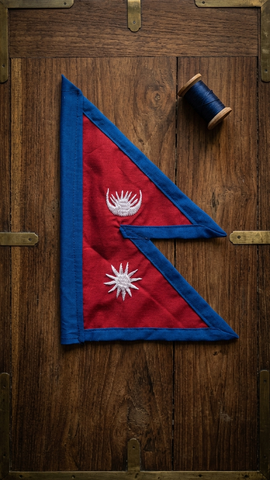 Miniature Nepal national flag on wooden stand with crimson red field, royal blue border and white embroidered moon and sun — — view 2