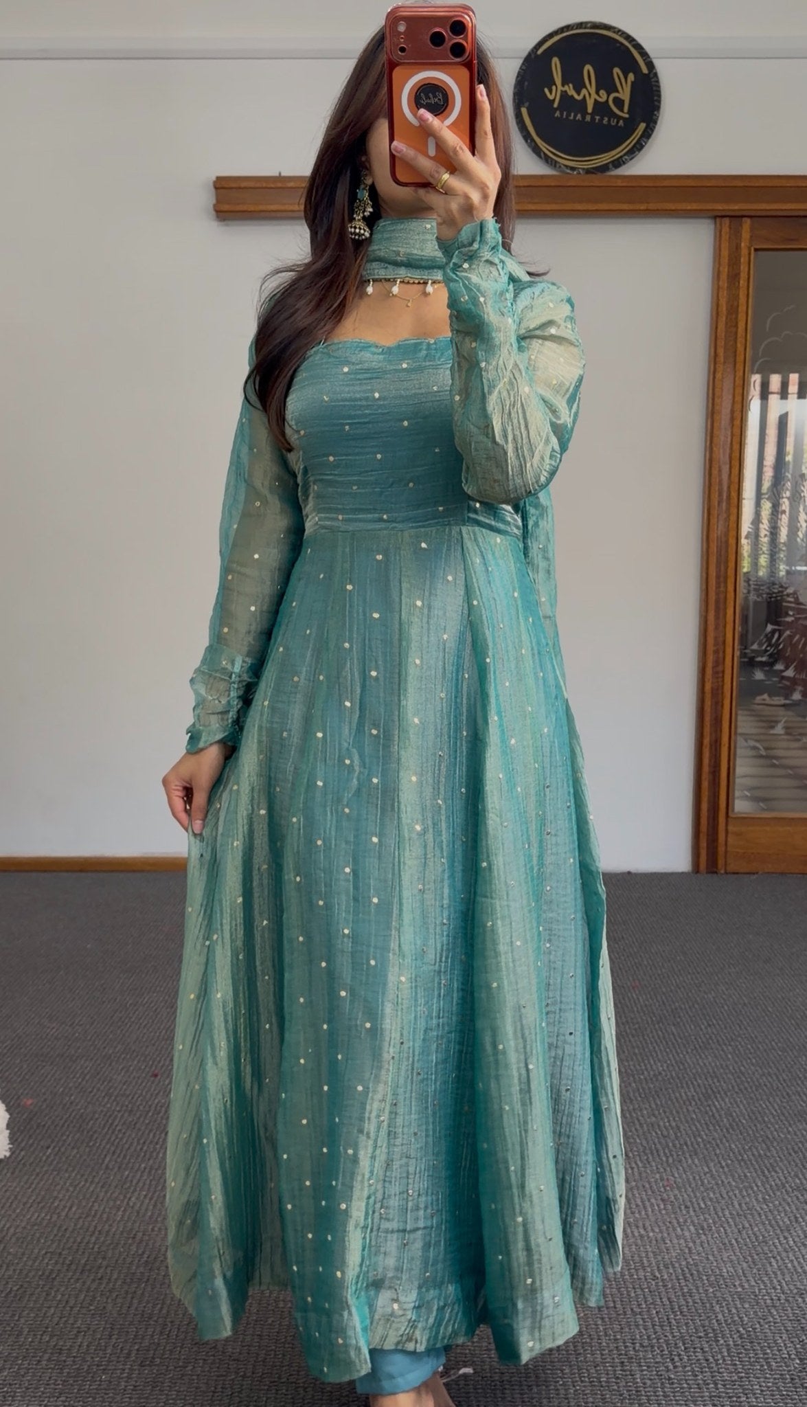Teal Anarkali gown with scattered sequin detailing, puffed sleeves, and matching beaded-edge dupatta draped over the arm — view 5