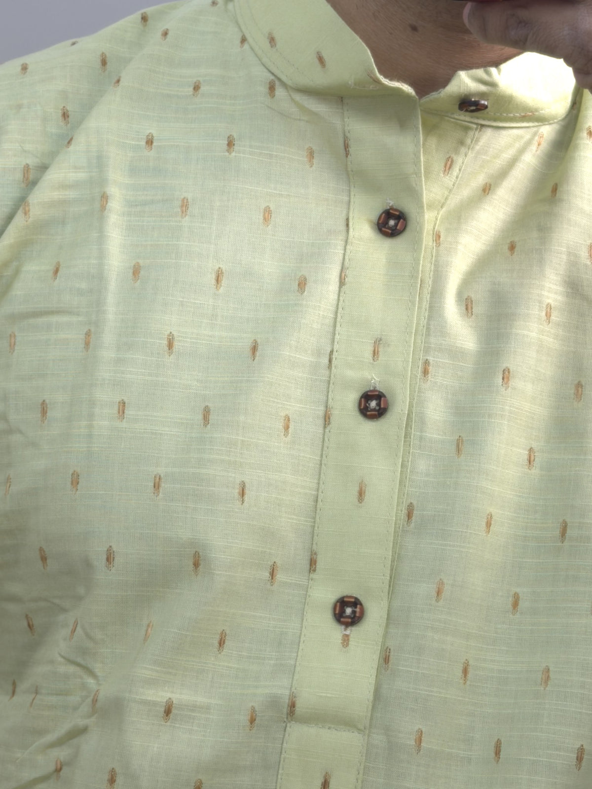 Pista green men's kurti with mandarin collar, printed motifs and button placket paired with white pants — view 2