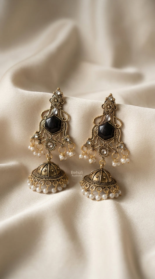 Antique gold oxidised jhumka earrings with black hexagonal stone, filigree frame, and pearl-finish bead drops — Behuli — view 2