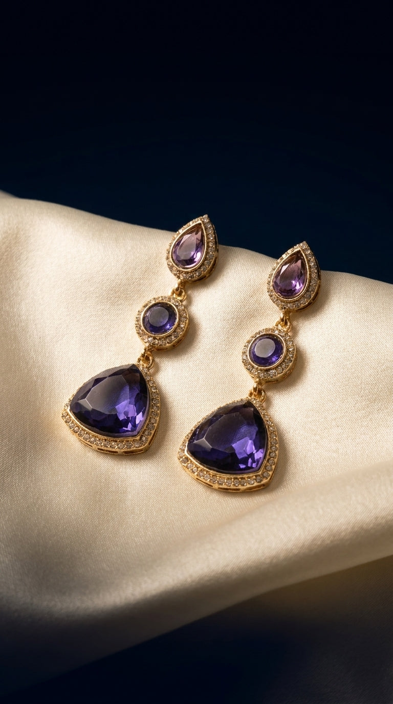 Deep violet purple three-tier drop earrings with crystal halo border and gold-tone metal setting — Behuli Australia
