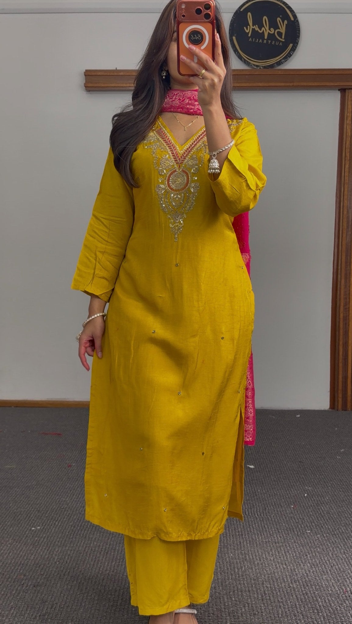 Mustard yellow kurti set with embroidered neckline paired with fuchsia pink Banarasi-style dupatta featuring gold floral — view 3