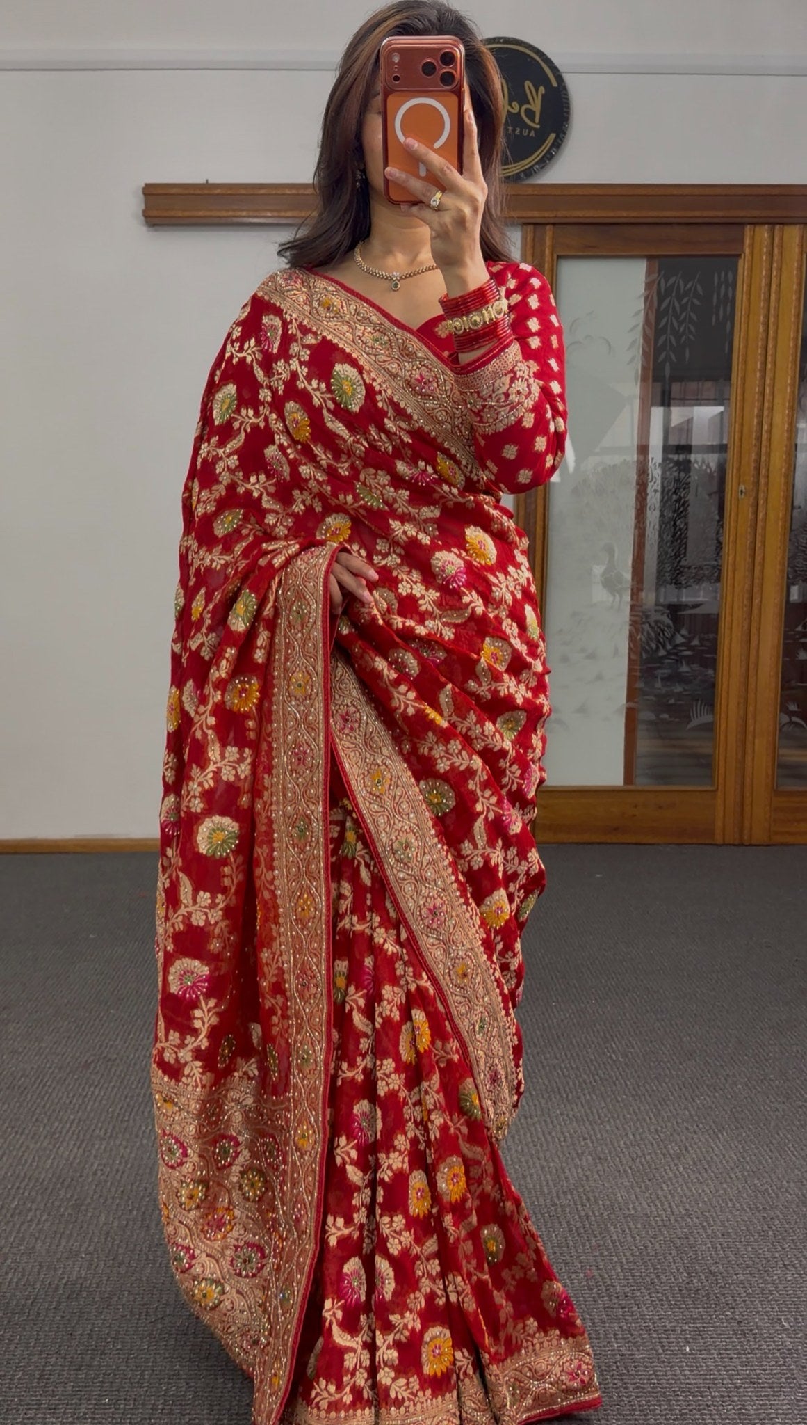Deep red Khaddi Georgette saree with all-over gold zari and multicolour resham floral embroidery and embroidered blouse —