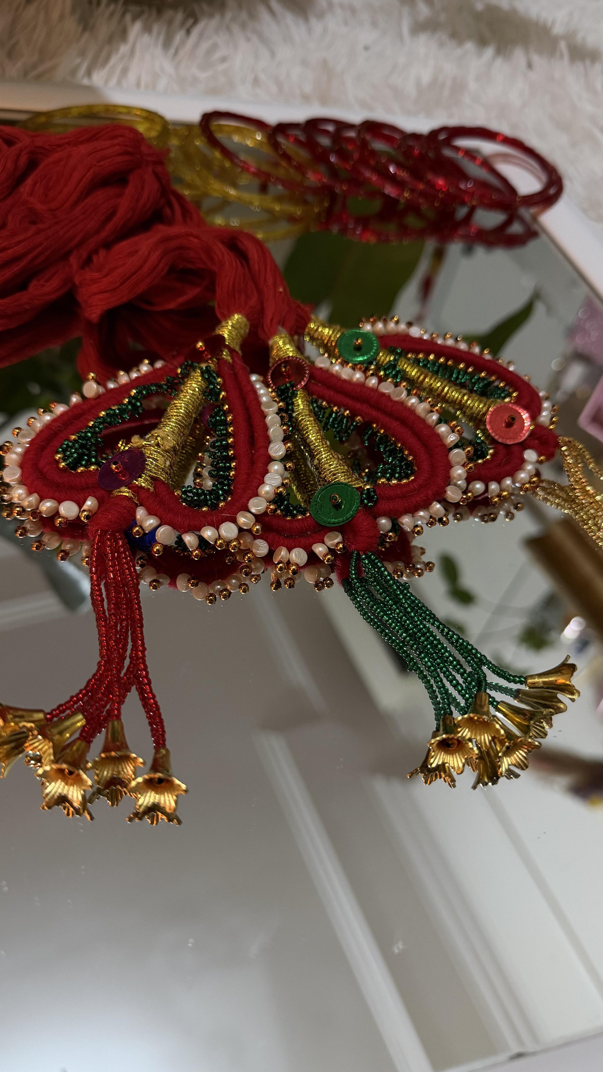 Crimson and gold handcrafted Lachha Dori with zari threadwork, seed beadwork, pearl border and gold bell tassels — Behuli