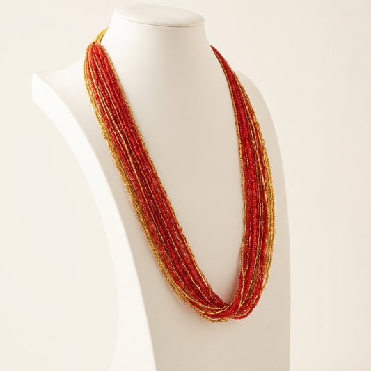 Red and gold multi-strand glass seed bead potey necklace on display bust — Behuli Australia