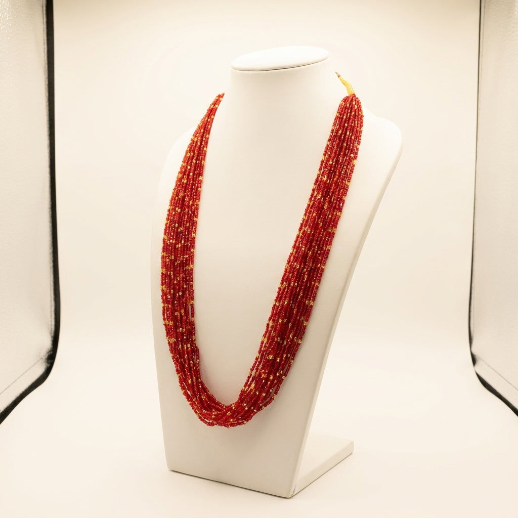 Red and gold multi-strand glass bead Potey necklace displayed on white jewellery bust — Behuli Australia