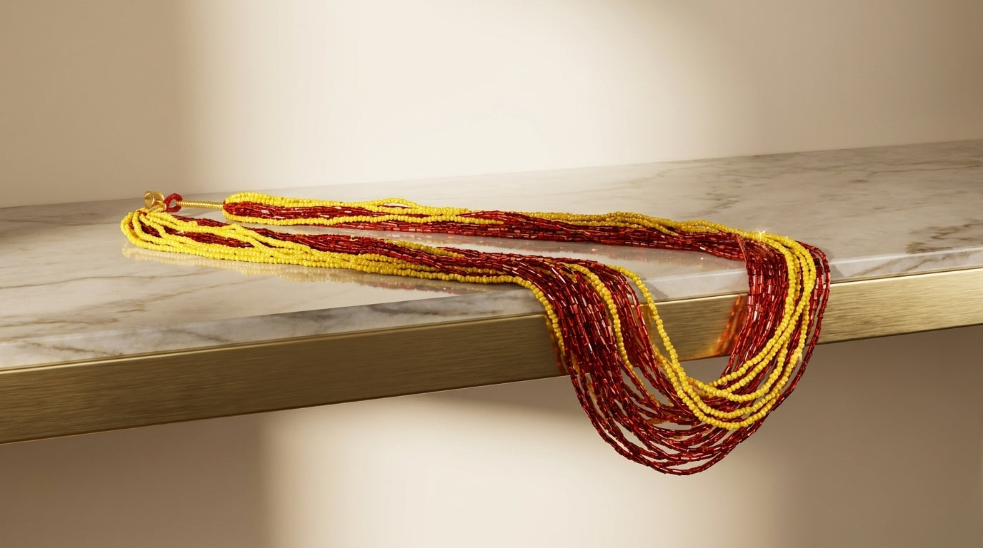 Multi-strand crimson red and golden yellow glass seed bead Potey necklace on display bust — Behuli Australia — view 3