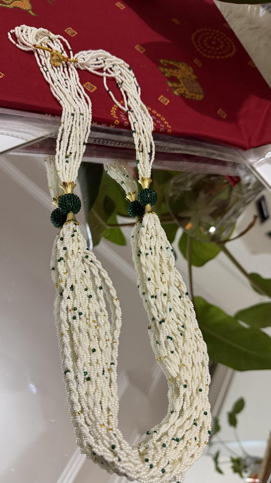 Ivory multi-strand seed bead potey necklace with emerald green beads and gold floral cap centrepiece balls — Behuli Australia — view 2