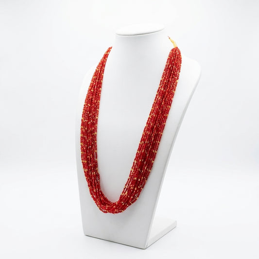 Red and gold multi-strand glass bead Potey necklace displayed on white jewellery bust — Behuli Australia — view 2