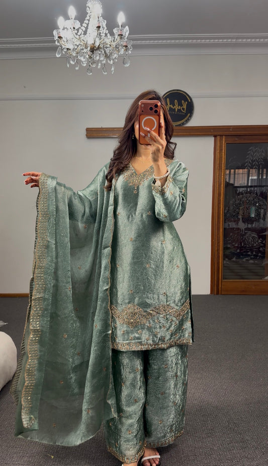 Sage green crushed silk three-piece palazzo kurti set with gold zari embroidery hem band and matching sequin dupatta —