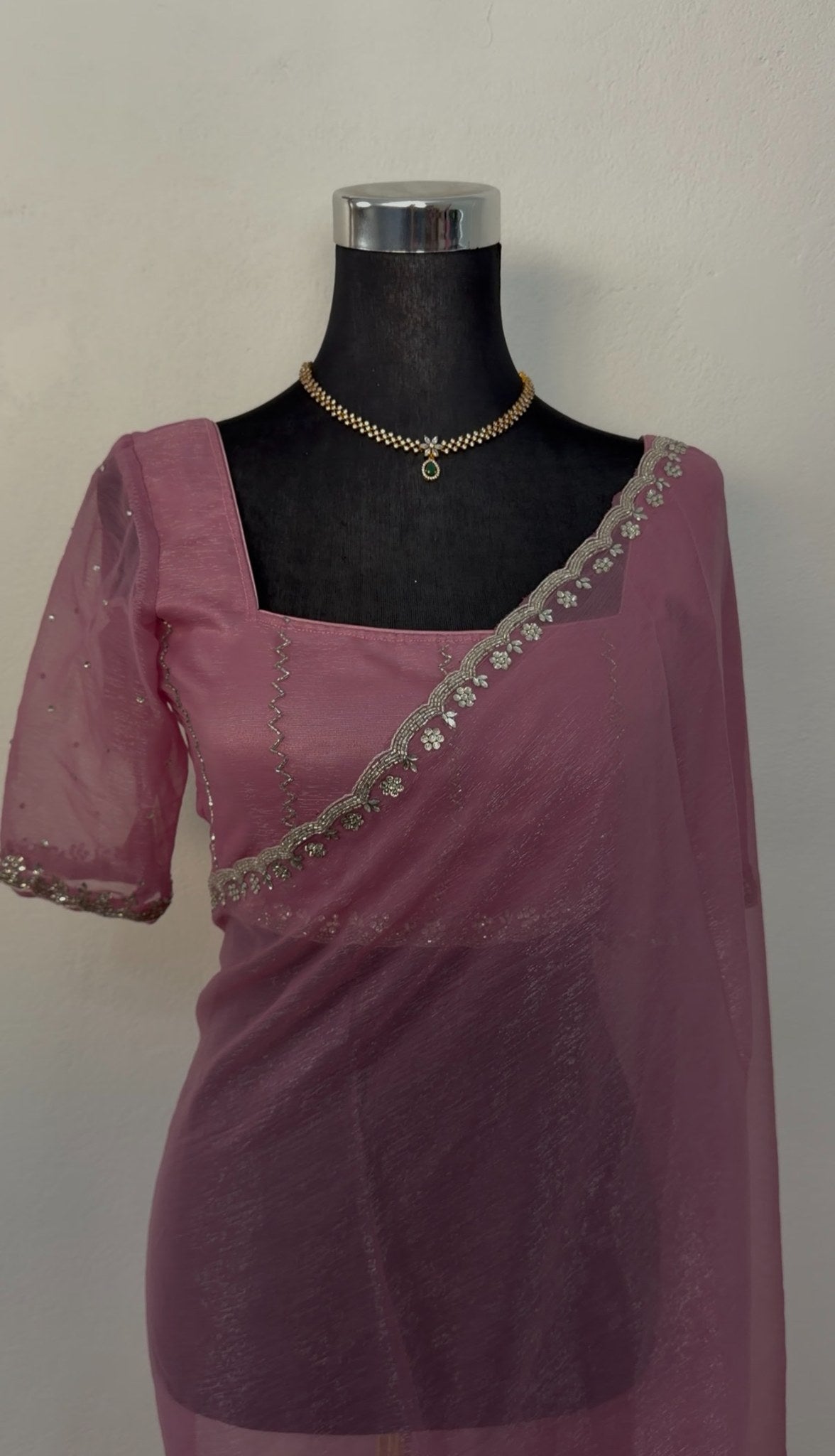 Dusty rose mauve organza saree with silver zari floral embroidery border and matching embroidered blouse on mannequin — — view 3