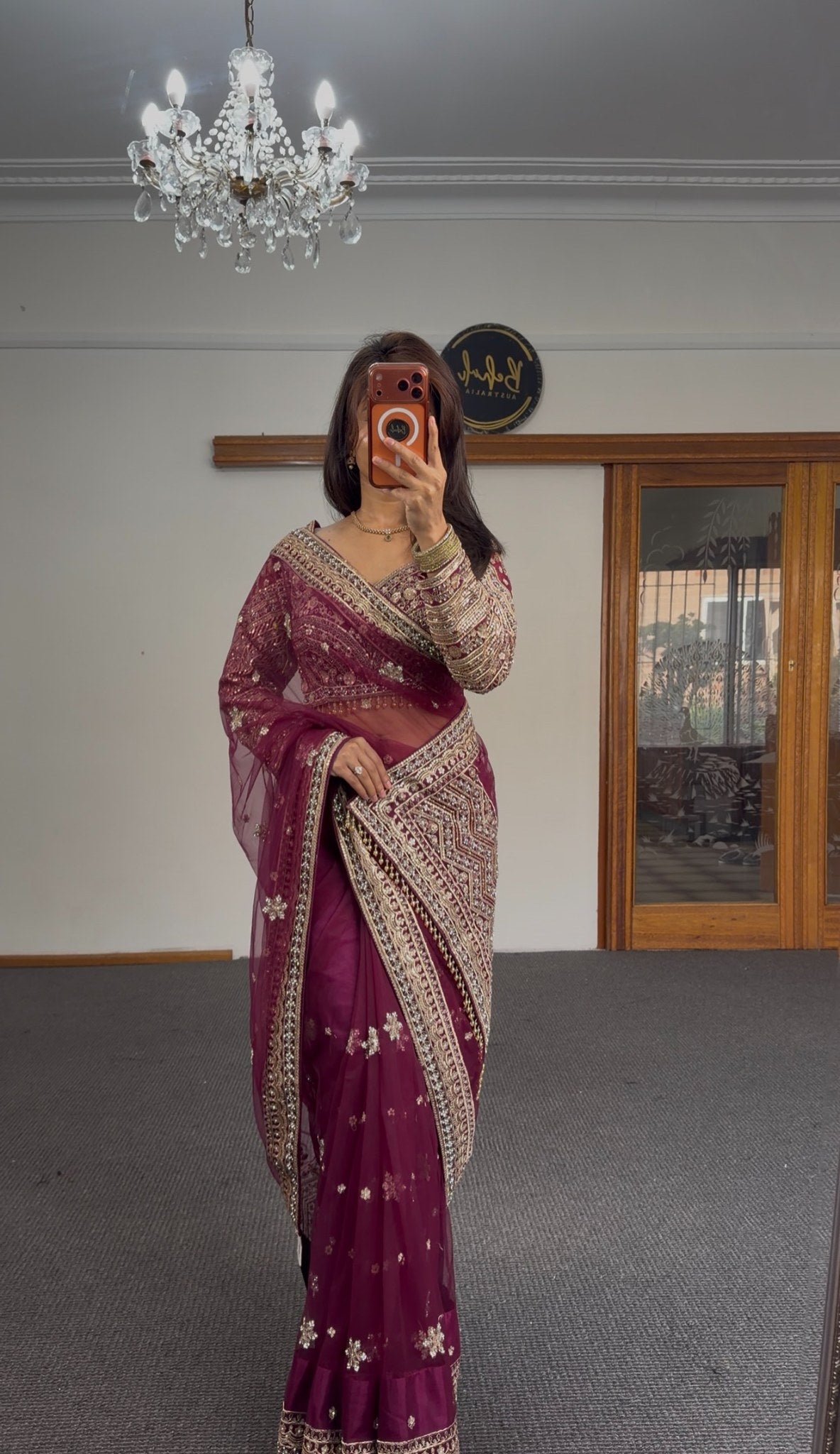 Burgundy organza saree with gold zari floral motifs and embroidered border, worn with matching full-sleeve embroidered — view 5