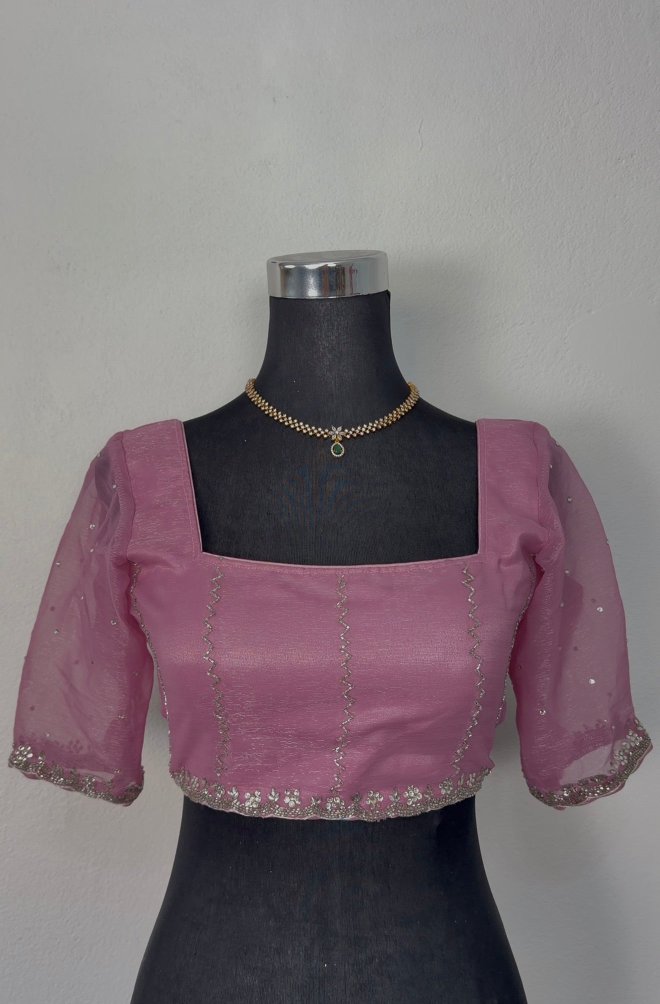 Dusty rose mauve organza saree with silver zari floral embroidery border and matching embroidered blouse on mannequin — — view 4