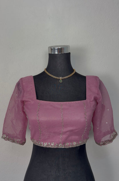 Dusty rose mauve organza saree with silver zari floral embroidery border and matching embroidered blouse on mannequin — — view 4