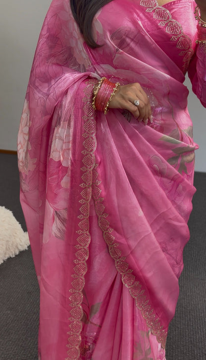 Pink floral printed saree with gold sequin border detailing and matching embroidered blouse draped elegantly — view 3