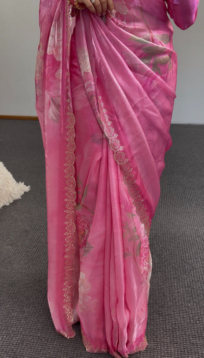 Pink floral printed saree with gold sequin border detailing and matching embroidered blouse draped elegantly — view 4