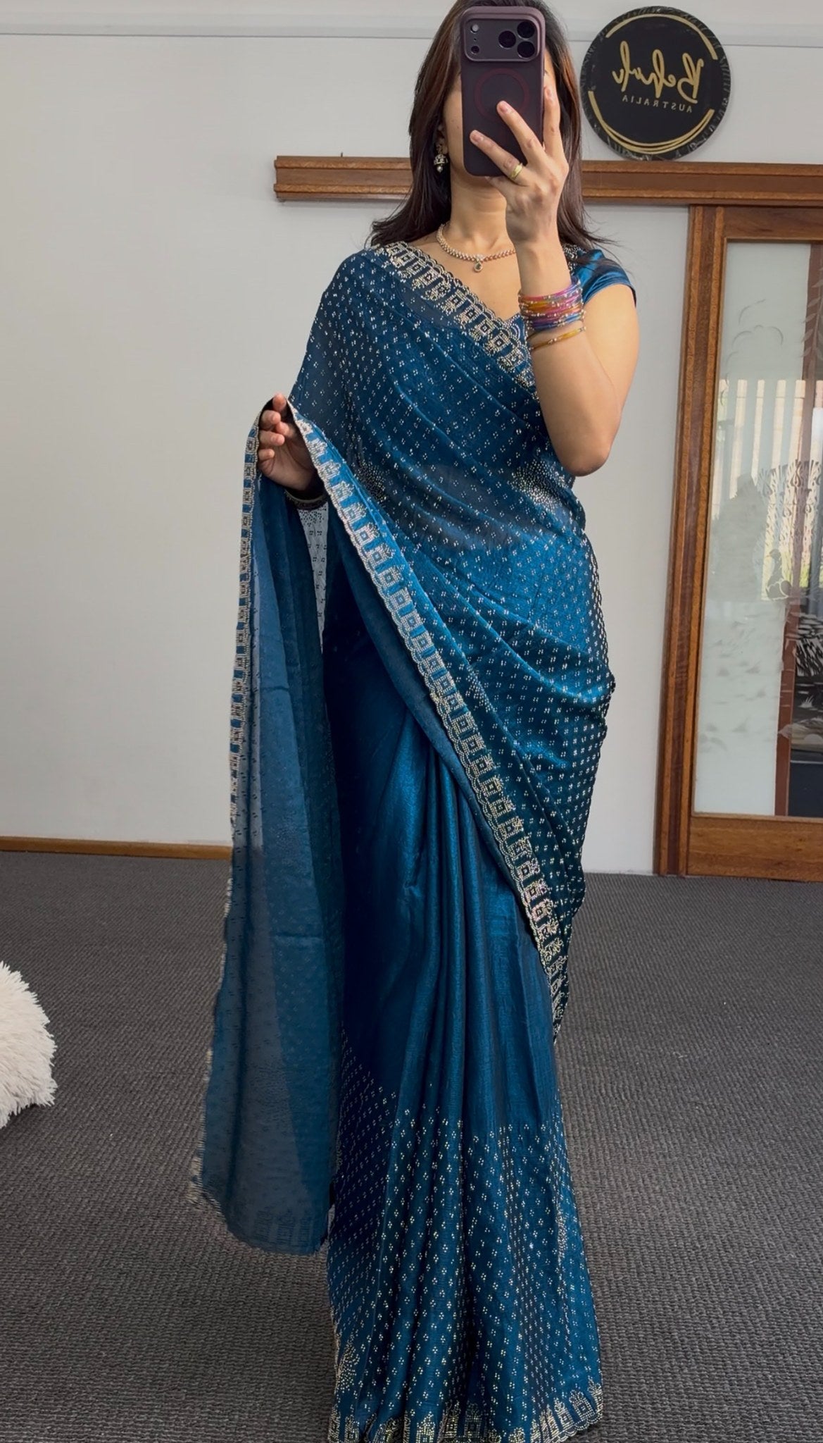 Teal bandhani print saree with sequin embroidery and embellished border draped elegantly — Behuli Australia