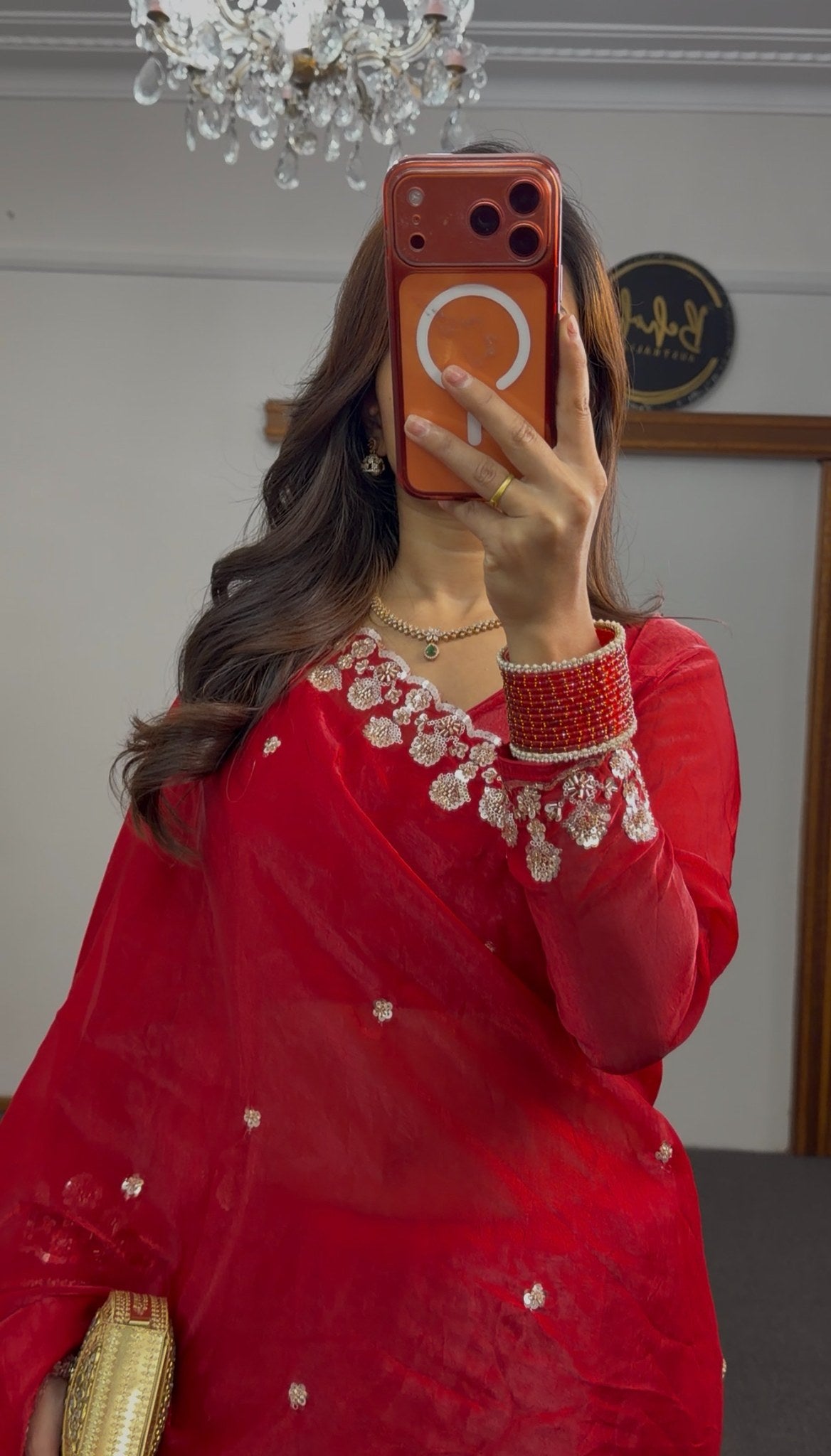 Red saree with silver sequin floral embroidery on border and pallu, draped with matching full-sleeve blouse — view 3