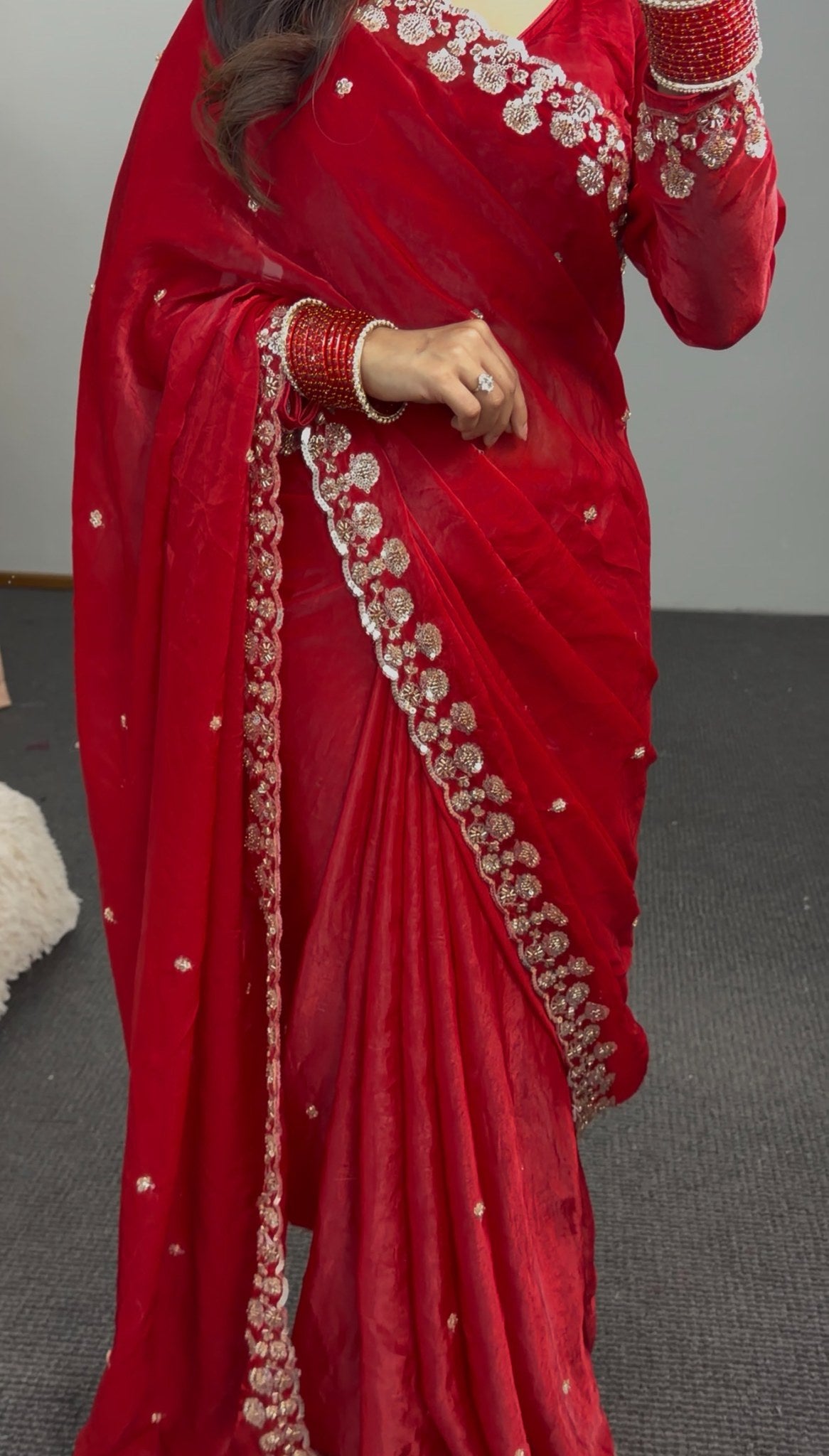 Red saree with silver sequin floral embroidery on border and pallu, draped with matching full-sleeve blouse — view 4