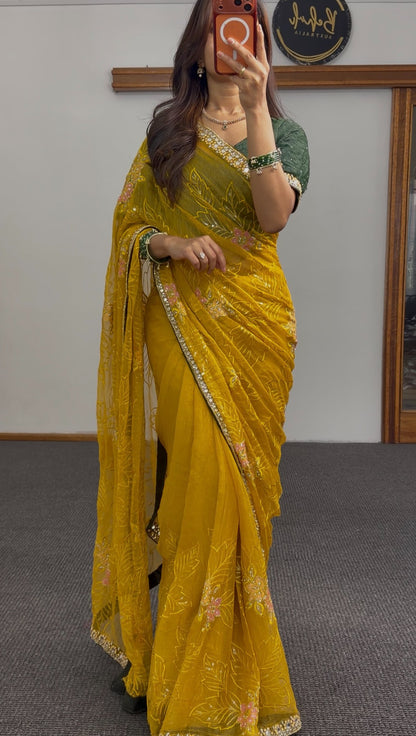 Mustard yellow saree with floral embroidery and sequin border worn with a green embellished blouse — Behuli Australia