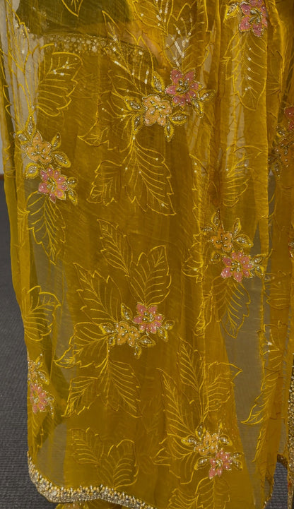 Mustard yellow saree with floral embroidery and sequin border worn with a green embellished blouse — Behuli Australia — view 3