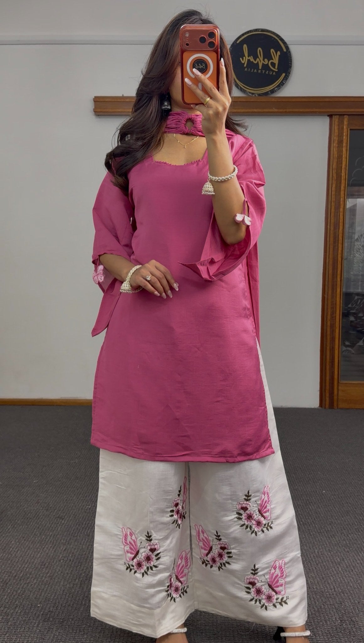 Rose pink straight kurti set with ivory white palazzo pants featuring floral and butterfly embroidery and matching dupatta —