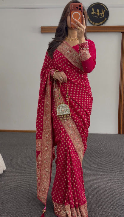 Rani pink khaddi georgette saree with gold zari butis and embellished border draped with matching blouse