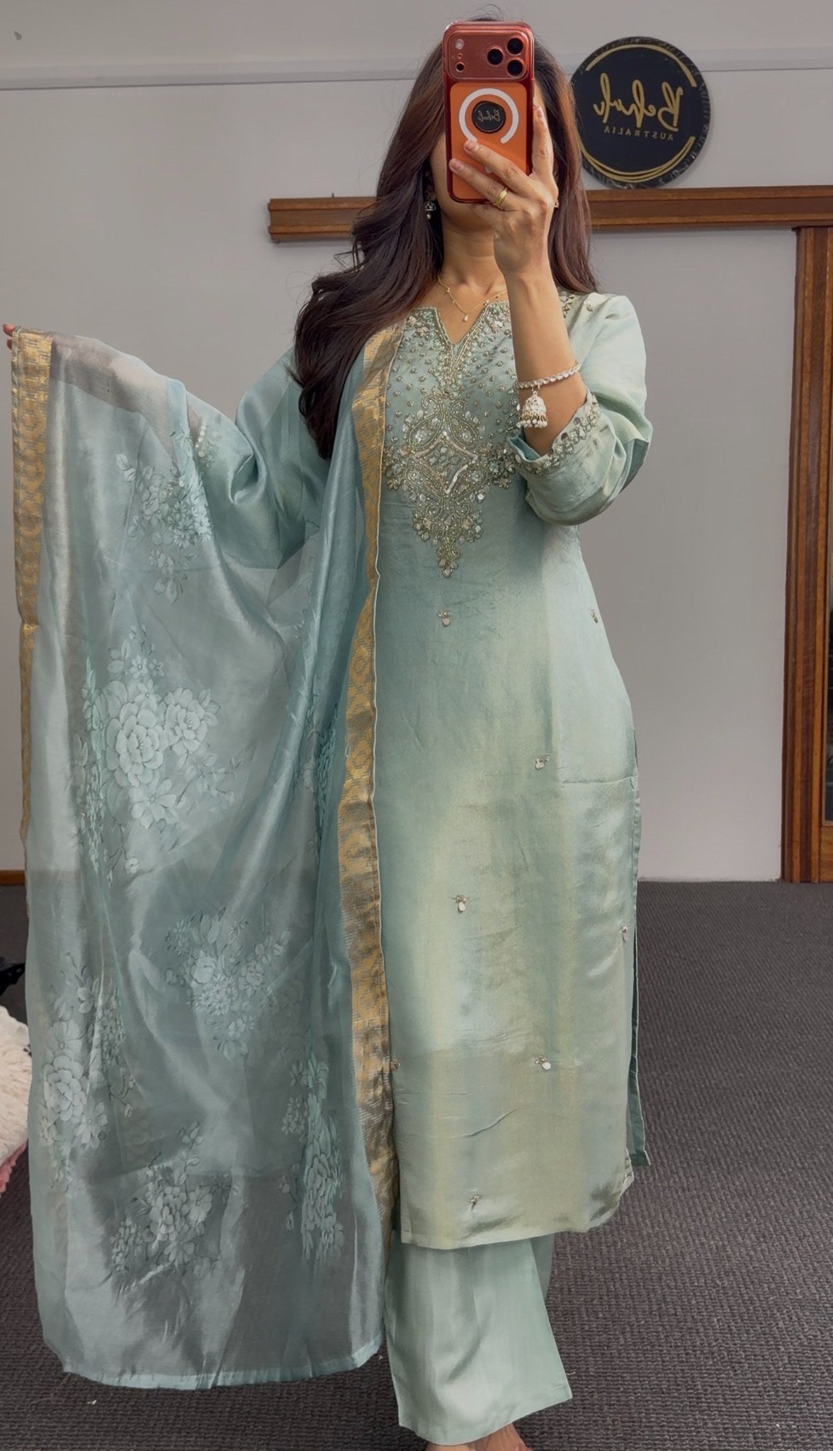 Sage green kurti set with embellished neckline, gold-bordered floral dupatta and matching palazzo pants