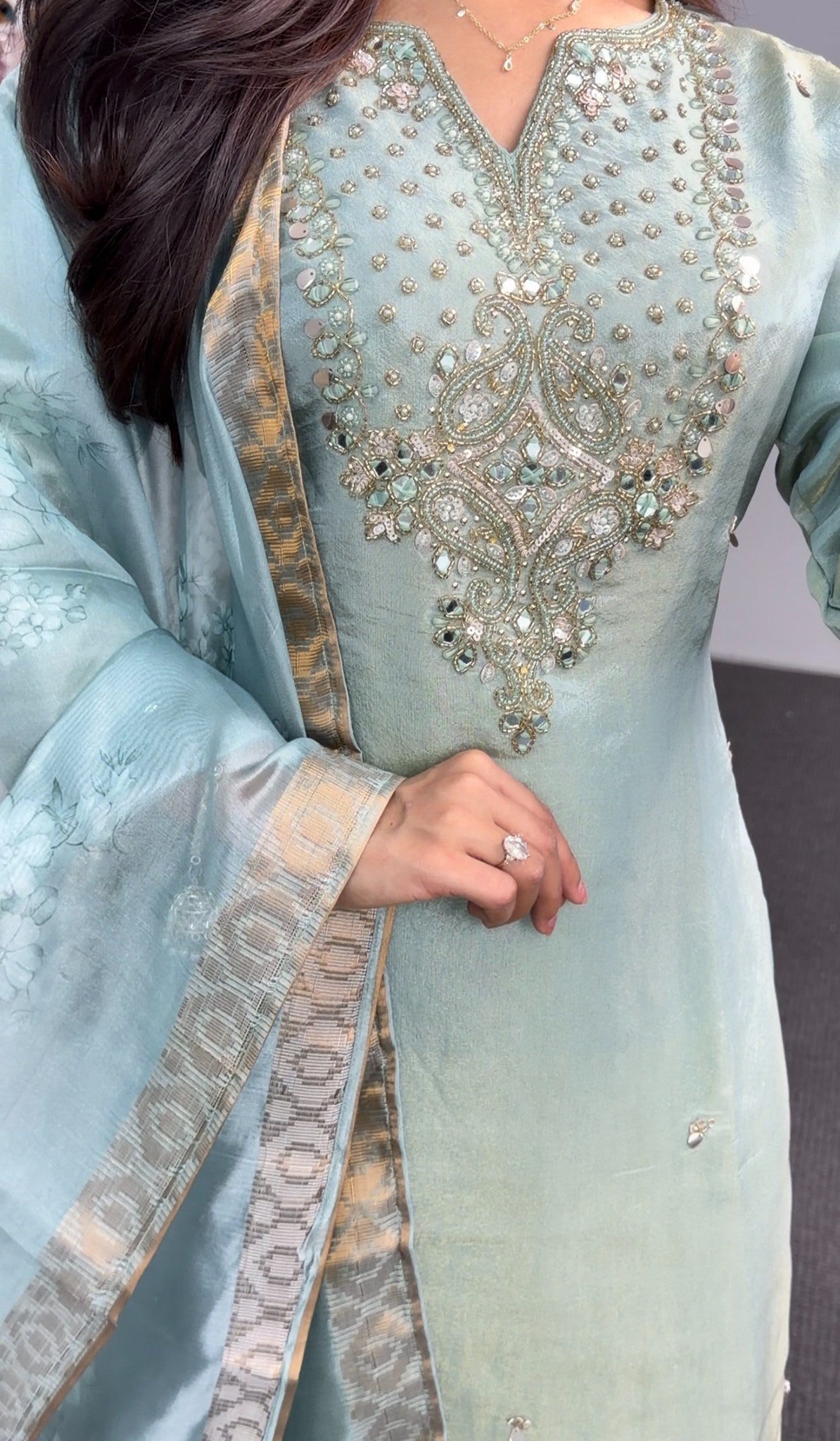 Sage green kurti set with embellished neckline, gold-bordered floral dupatta and matching palazzo pants — view 4