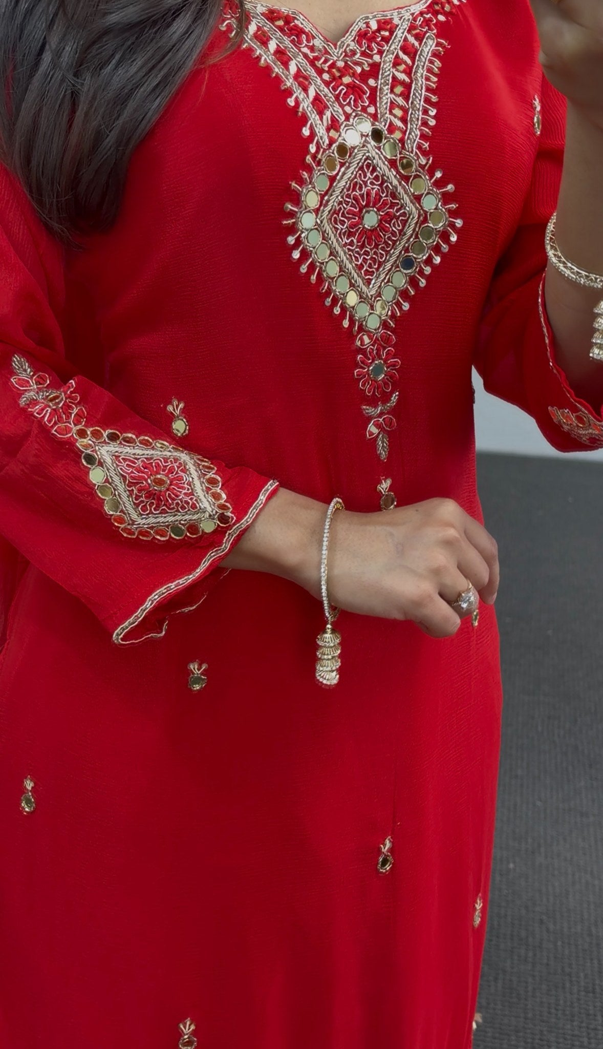 Red georgette palazzo suit set with gold sequin embroidery, mirror detailing and pearl tassels, paired with matching dupatta — view 2