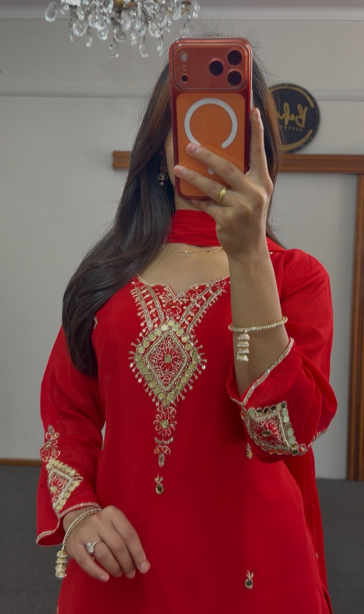 Red georgette palazzo suit set with gold sequin embroidery, mirror detailing and pearl tassels, paired with matching dupatta — view 3
