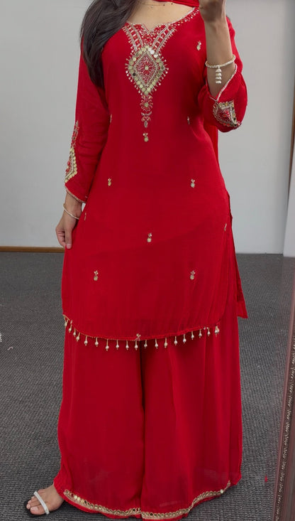 Red georgette palazzo suit set with gold sequin embroidery, mirror detailing and pearl tassels, paired with matching dupatta — view 4