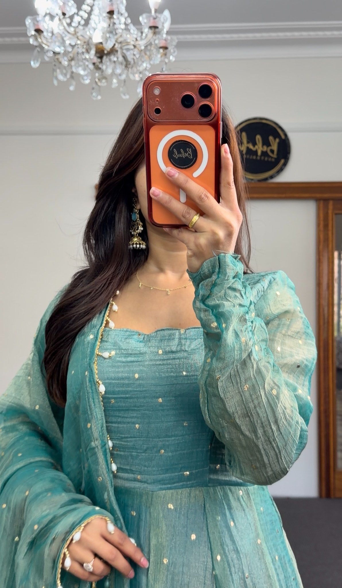 Teal Anarkali gown with scattered sequin detailing, puffed sleeves, and matching beaded-edge dupatta draped over the arm — view 2
