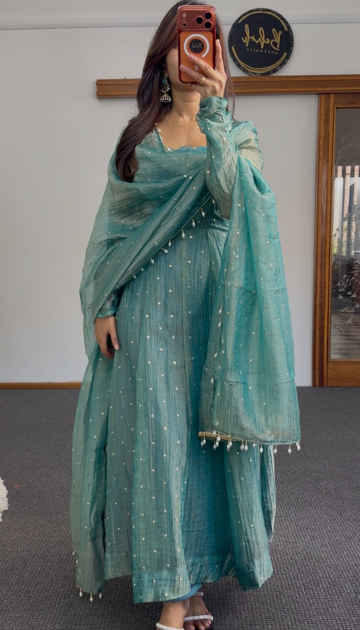 Teal Anarkali gown with scattered sequin detailing, puffed sleeves, and matching beaded-edge dupatta draped over the arm — view 4