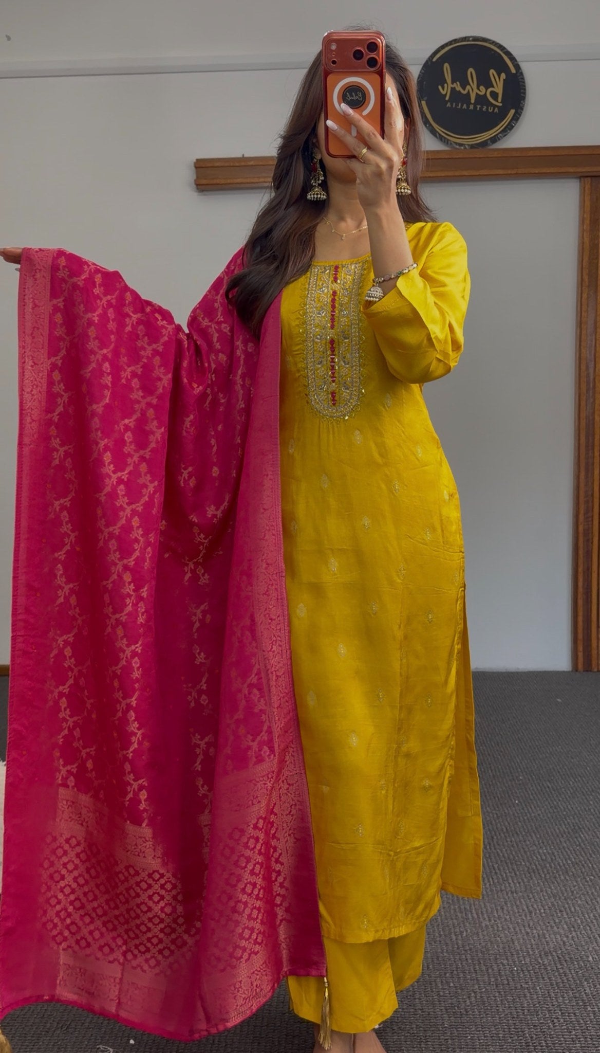 Mustard yellow kurti set with embroidered neckline paired with a fuchsia pink woven floral dupatta