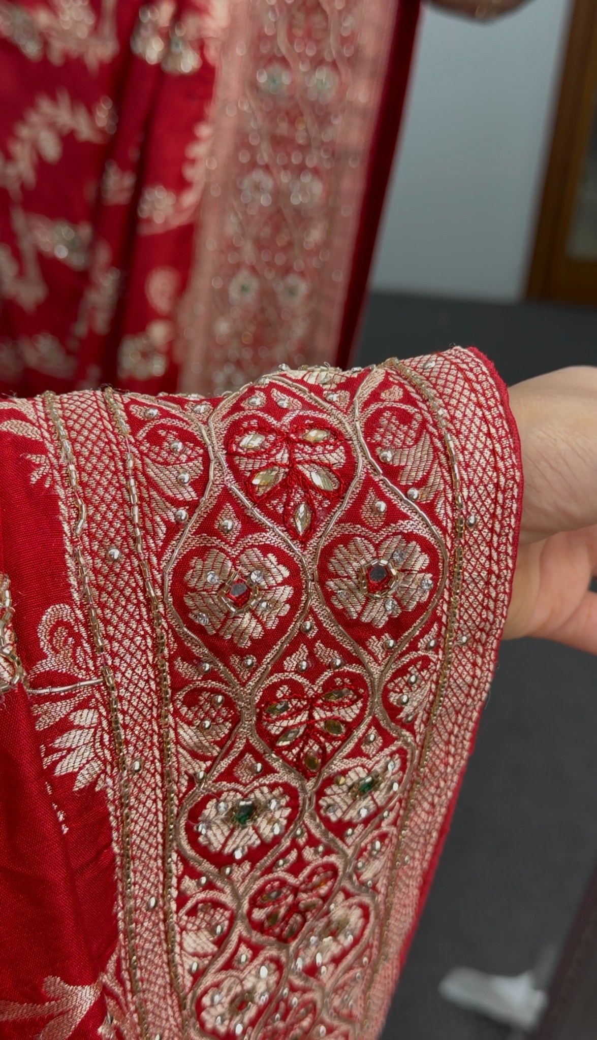 Red Khaddi georgette saree with gold zari embroidered border and sequin detailing draped with matching red blouse — view 3