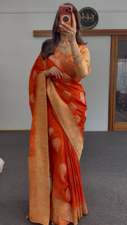 Burnt-orange saree with gold zari buta motifs and ornate woven border, styled with matching blouse — Behuli Australia