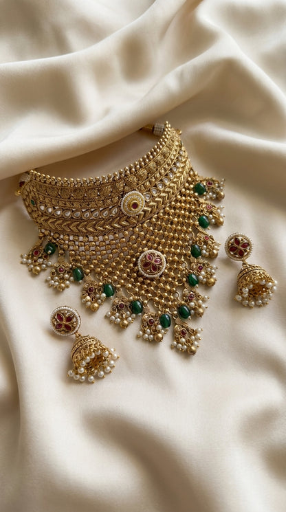 Antique gold choker and jhumka earring jewellery set with kundan-style setting, green stone and pearl drop accents — Behuli