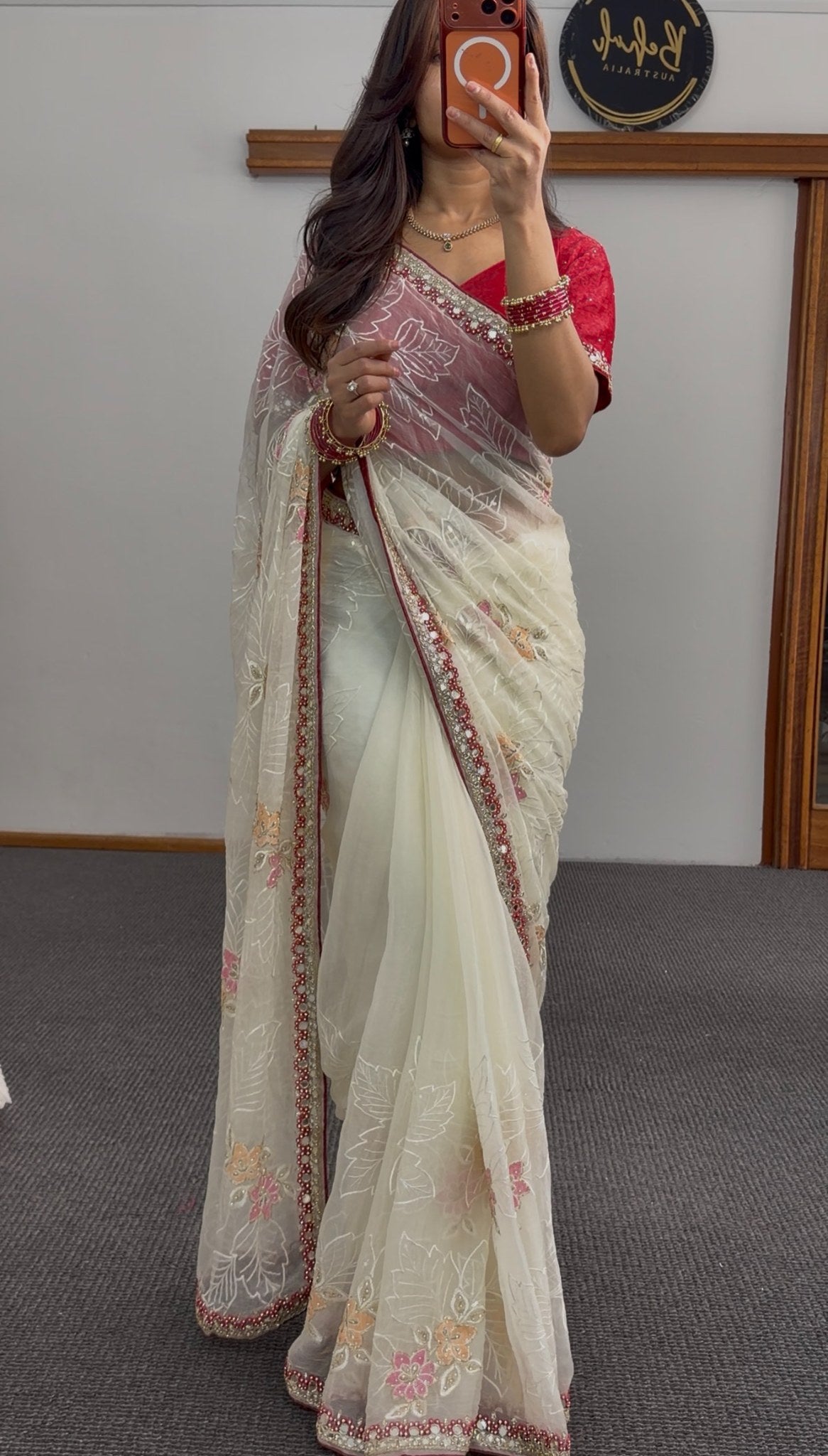 Ivory organza saree with floral embroidery, maroon stone-work border and red embroidered blouse — Behuli Australia