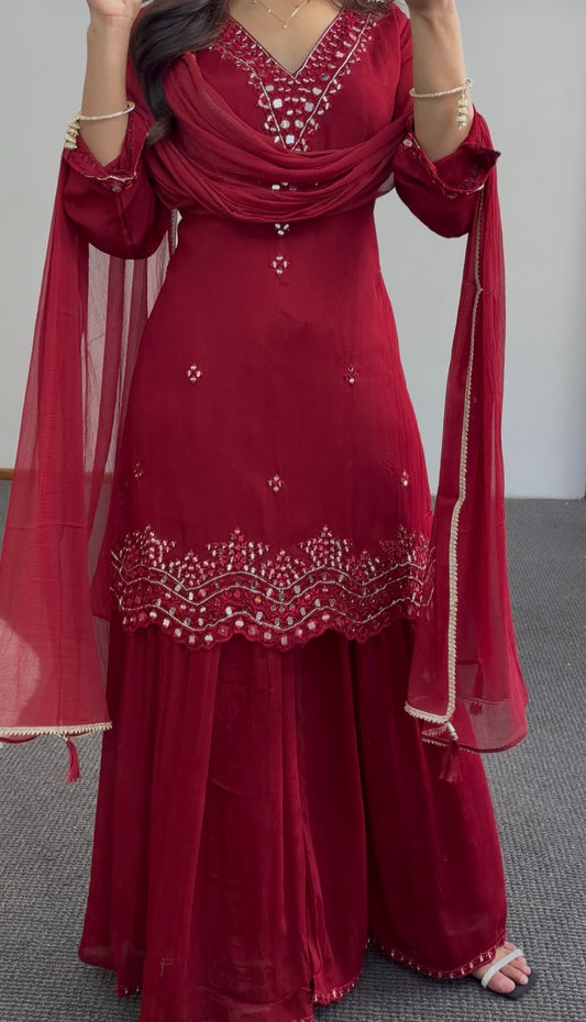 Maroon palazzo suit set with mirror work embroidery, scalloped hemline and matching dupatta worn by a model — view 2