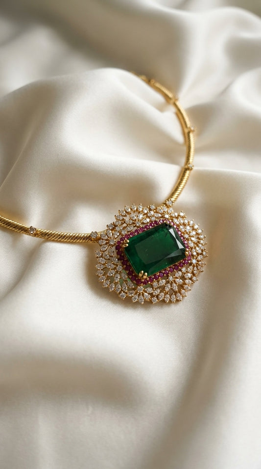Emerald green rectangular stone choker necklace with white crystal halo, pink accent border and gold-tone rigid collar chain