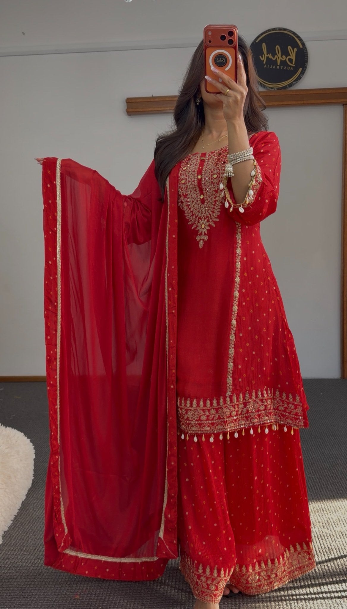 Deep red sharara anarkali suit with gold zari embroidery, woven buti pattern and pearl-drop tassels — Behuli Australia — view 2