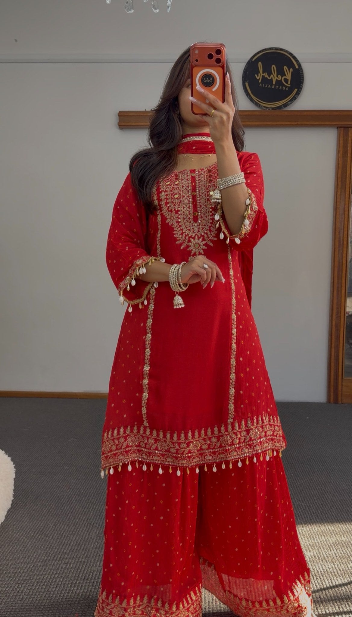 Deep red sharara anarkali suit with gold zari embroidery, woven buti pattern and pearl-drop tassels — Behuli Australia — view 4