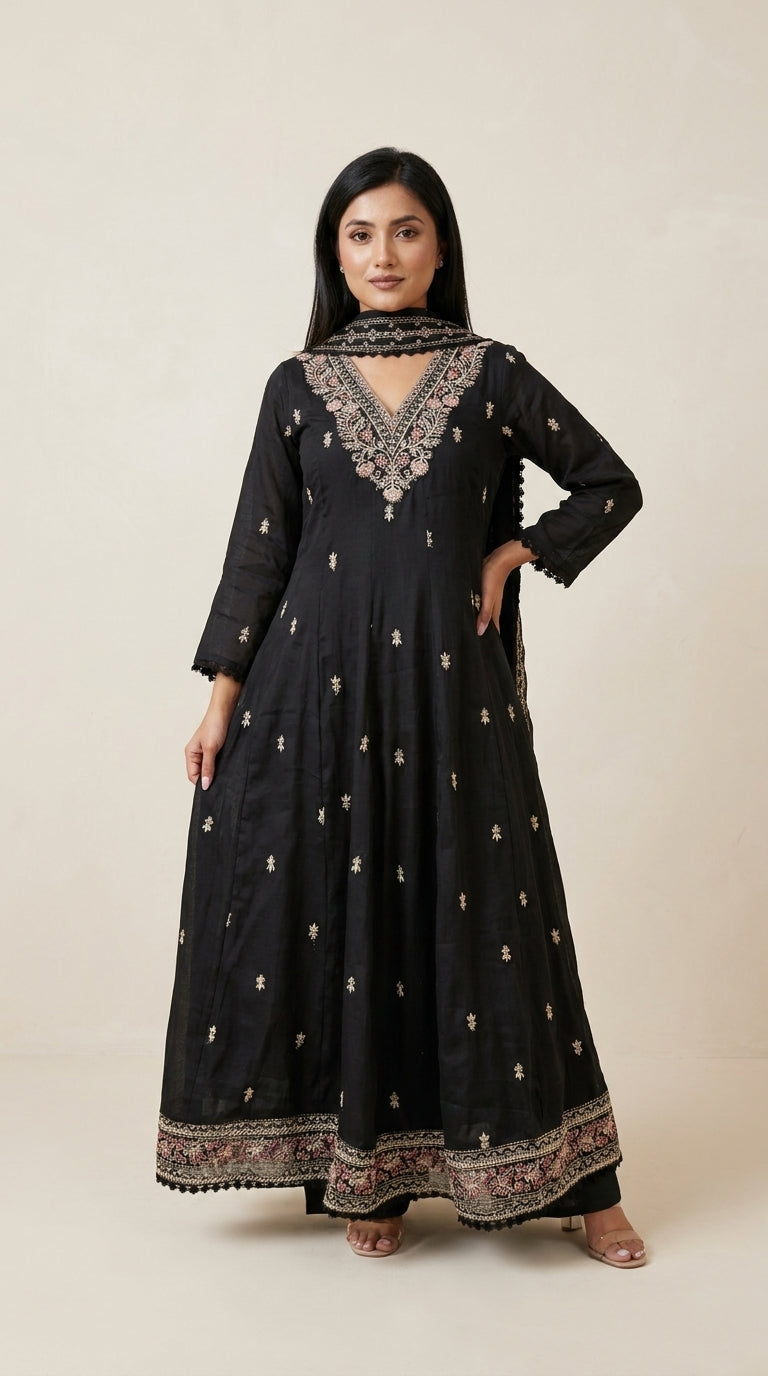 Black Anarkali suit set with floral embroidered neckline, gold buti motifs, embroidered hem border and matching dupatta —