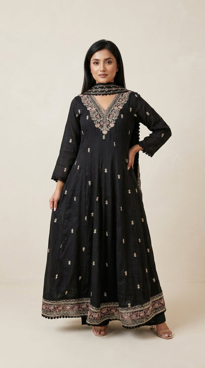Black Anarkali suit set with floral embroidered neckline, gold buti motifs, embroidered hem border and matching dupatta —