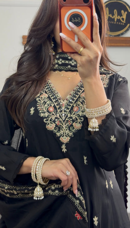 Black Anarkali suit set with floral embroidered neckline, gold buti motifs, embroidered hem border and matching dupatta — — view 3
