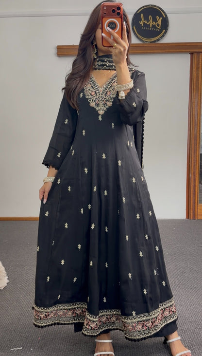 Black Anarkali suit set with floral embroidered neckline, gold buti motifs, embroidered hem border and matching dupatta — — view 4