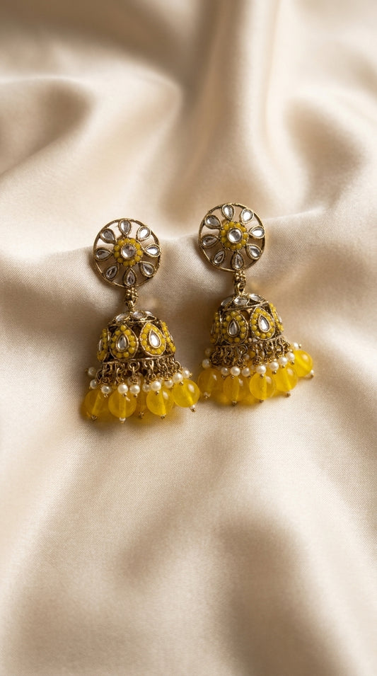 Gold-toned kundan jhumka earrings with cage dome, oval stone setting and cascading lavender bead drops on ivory silk — — Yellow